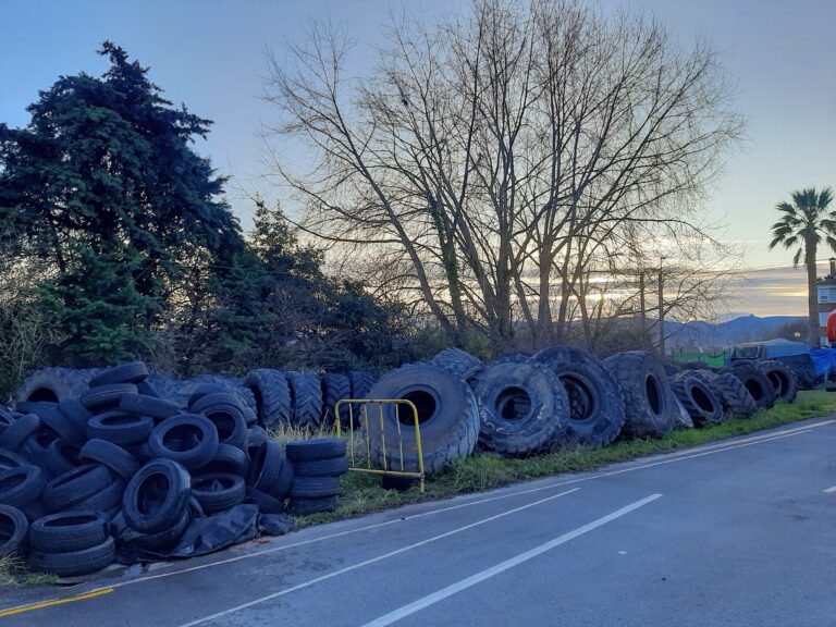 A beautiful sunset, with some not so lovely used tyres.